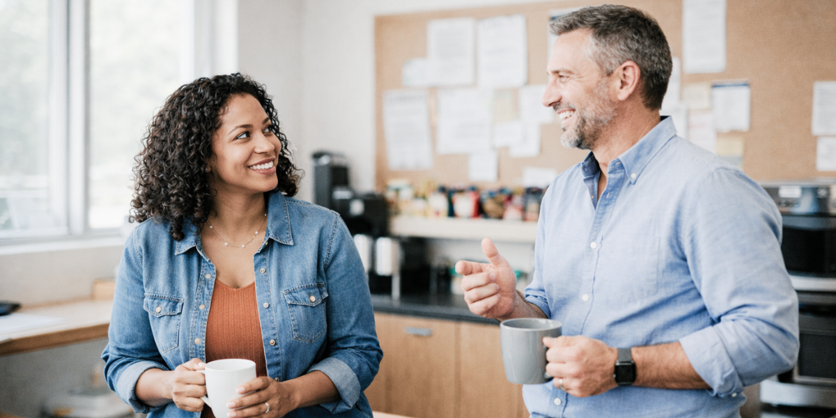 Two coworkers having a casual workplace conversation about life with LTC benefits over coffee.